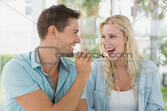 Hip young couple having desert together