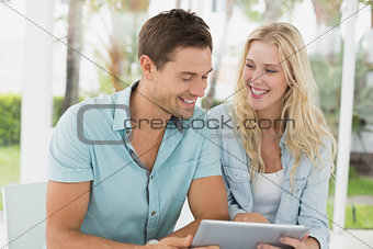 Hip young couple using tablet together