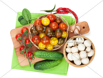 Fresh ingredients for cooking: tomato, cucumber, mushroom and sp