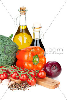 Fresh ingredients for cooking: tomato, pepper, cabbage and spice