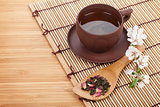 Japanese green tea and sakura branch