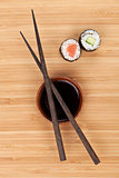 Maki sushi, chopsticks and soy sauce