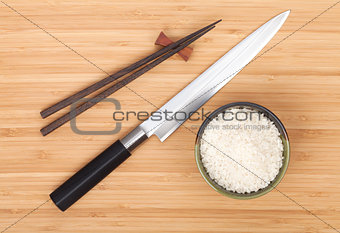 Rice bowl, chopsticks and sushi knife