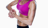 Female bodybuilder posing with hands together