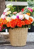 Fake fabric roses in basket