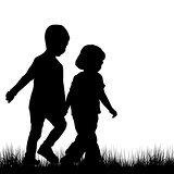 Couple of children silhouettes outdoor