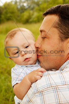 little boy with his father on the nature 