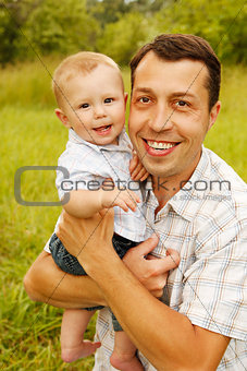 little boy with his father on the nature 