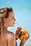 Portrait of woman relaxing with cocktail at cuban beach