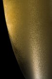 half champagne flute with gold fine bubbles