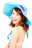 young woman holding a sun hat . isolated on a white background