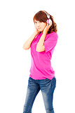 Portrait of cute young woman listening to music with headphones