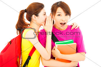 young student talking to his friend with surprised expression