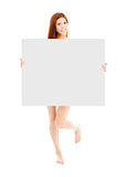 Beautiful young sexy woman holding a empty white board