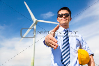 business man handshake cooperate to do wind power fuel