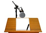 Podium with Microphone and Blank Papers