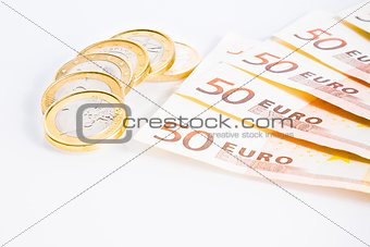 crisis of eurozone, euro coins on 50-euro banknotes