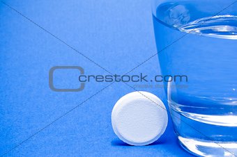 water glass near a tablet