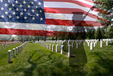 Soldier silhouette, american flag and grave stones.