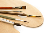Brushes on natural wooden palette