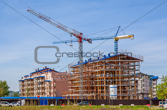 Cranes and new modern buildings.