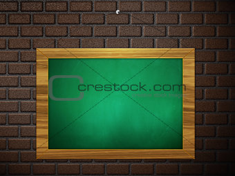 Green chalkboard hang on brick wall