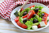 Mediterranean salad with black olives, lettuce, cheese and tomatoes