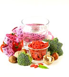 dried goji berries, water, nuts and fresh vegetables for a healthy diet