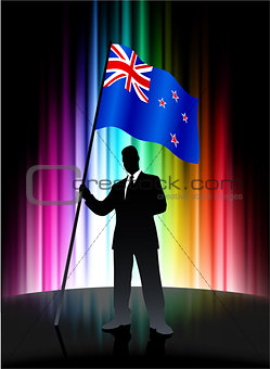 New Zealand Flag with Businessman on Abstract Spectrum Backgroun