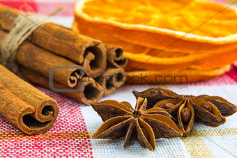 anise stars and cassia cinnamon sticks with dried orange rings