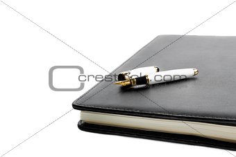 notebook and pen in composition
