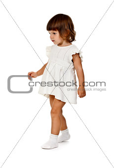 little girl in a knitted dress in the studio