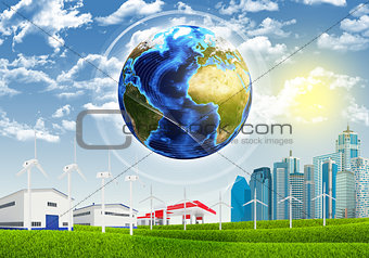 Earth, grass, skyscrapers and industrial area