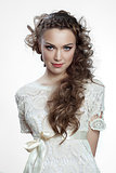 Pretty russian woman with curly hair on white background