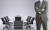 Businessman and conference table with laptops
