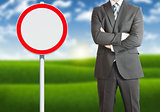 Businessman with road sign