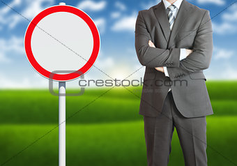 Businessman with road sign
