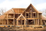 McMansion type house under construction in framing phase