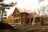 McMansion type house under construction in framing phase