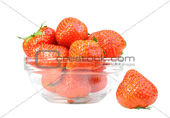 Red strawberries in transparent plate isolated on white