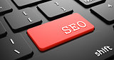 SEO on Red Keyboard Button.