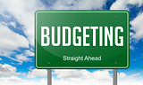 Budgeting on Green Highway Signpost.