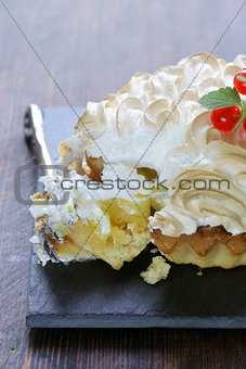 tart with lemon cream and meringue decorated with currants