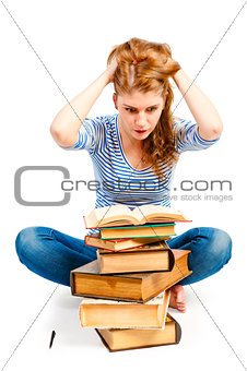 student with bulging eyes reading a book