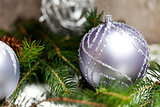 Silver Christmas ornaments in leaves