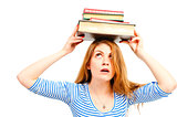 beautiful girl holding pile of books over his head