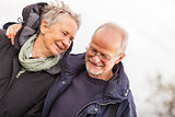 happy mature couple relaxing baltic sea dunes 
