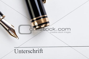 macro closeup sign document contract pen filler 