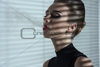 smoking girl in indoor fashion shot 