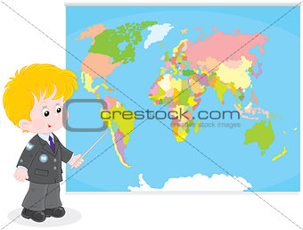 Schoolboy at a World map
